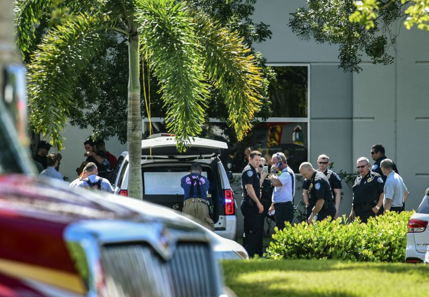 Law enforcement officials from the Broward Sheriff’s Office bomb squad and Sunrise Police and Fire Rescue at the scene where a suspicious package was found Wednesday inside the Sunrise (Fla.) Utility Administrative Center in Sunrise; Rep. Debbie Wasserman