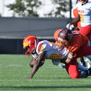 Back of the Yards’ Eddie Ramirez (6) brings down North Lawndale’s Rajuan Jones (22). Worsom Robinson/For the Sun-Times.