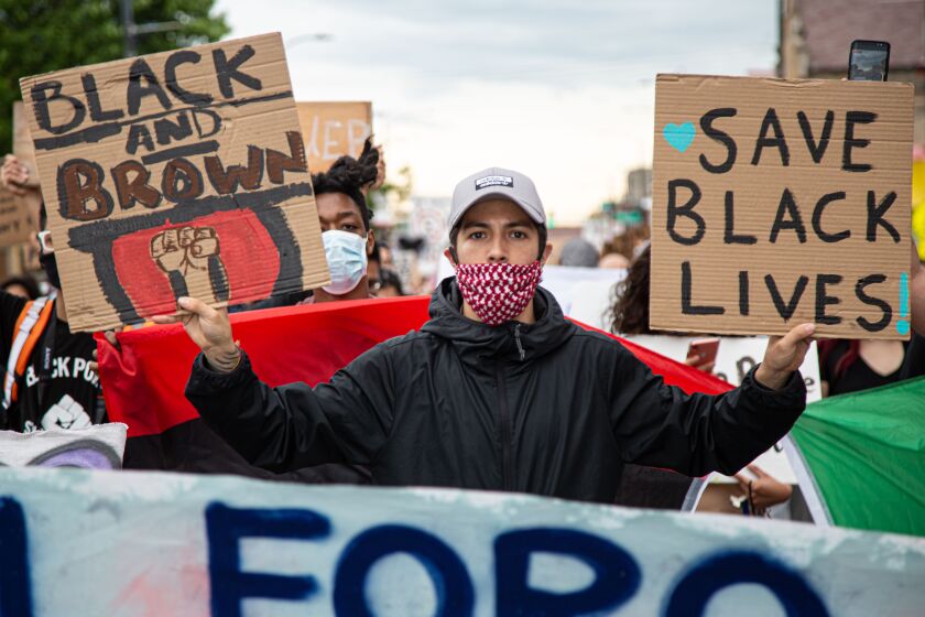 Residents in Little Village marched to support the Black Lives Matter movement and to call for unity on June 3, 2020.