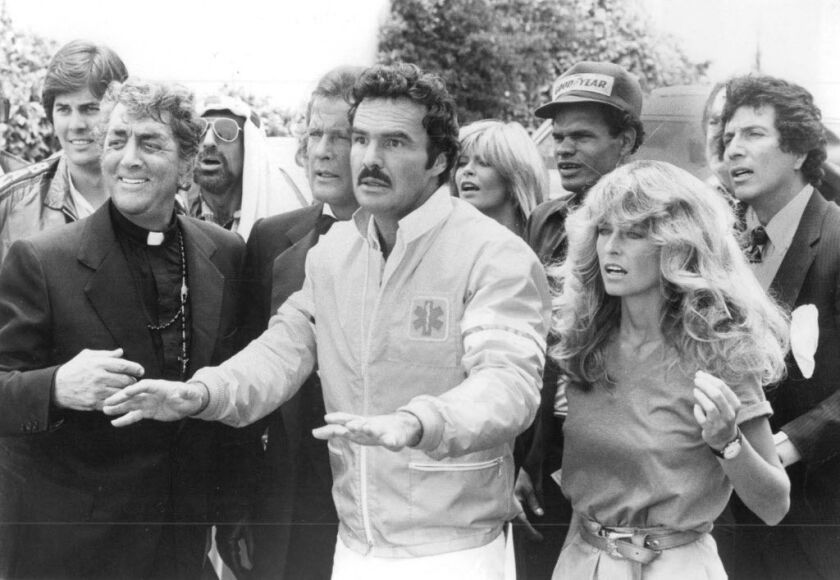 From left, Dean Martin, Roger Moore, Burt Reynolds, Farrah Fawcett and Bert Convy played five of the daredevil contestants speeding cross-country in “The Cannonball Run.”