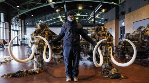 Artist Nick Cave stands in front a wooly mammoth that will be controlled by four dancers for his work “Nick Cave: Mammoth” during a video shoot at the Theater by the Lake at North DuSable Lake Shore Drive and West Fullerton Parkway on the lakefront.