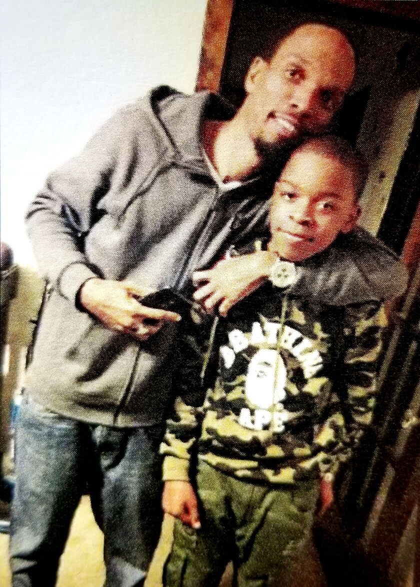 Rodney White-EL (left) and his son Khalil when he was still a younger kid. White-EL changed his life for his son, doted on him, gave him his first haircut and every other haircut over 18 years. 