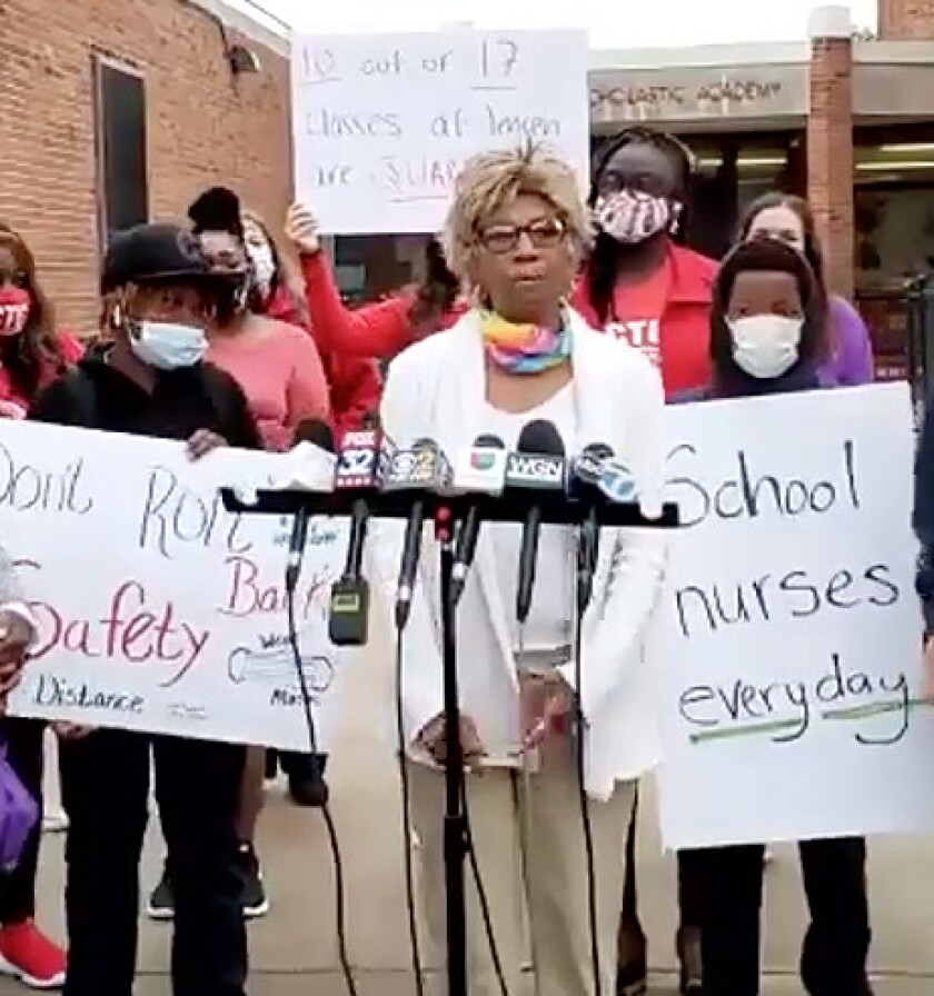 Linda Jiles, a school nurse at Jensen Elementary on the West Side where more than half of students are under quarantine, calls for enhanced safety measures at a news conference Wednesday.