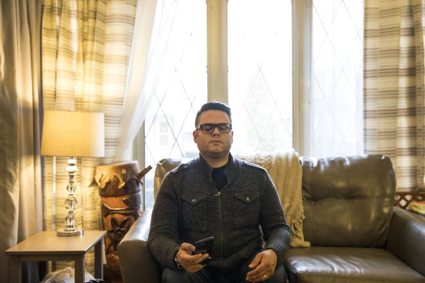 Efraín Martínez, principal at Orozco Community Academy, meditates with the help of the Daily Calm app at his home on the Southwest Side. | Ashlee Rezin/Sun-Times