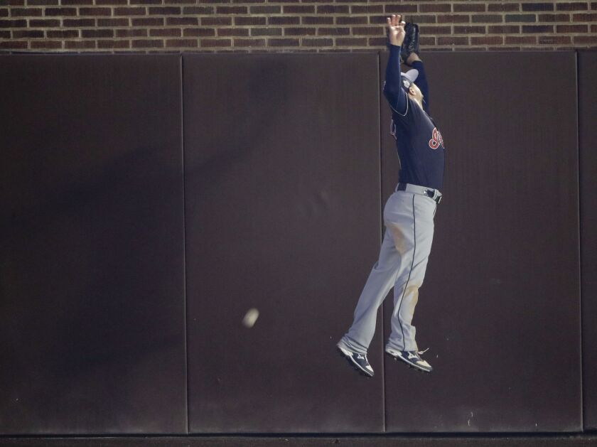 <em>Indians right fielder Lonnie Chisenhall can’t get a glove on a triple by Cubs’ Jorge Soler. (AP Photo/Charlie Riedel)</em>