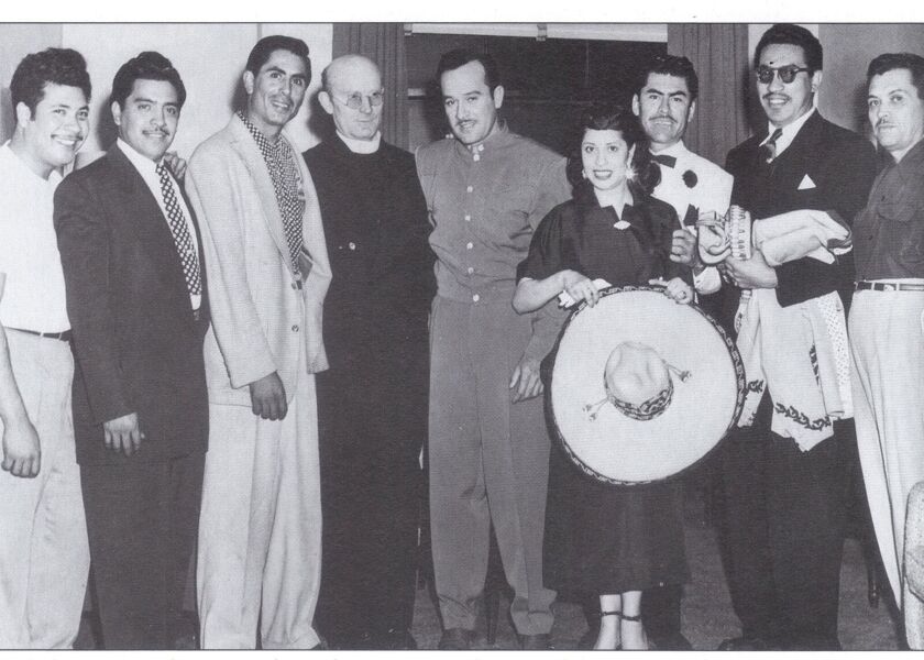 Raquel Ontiveros holds a hat next to Mexican actor-singer Pedro Infante, (center of photo, in button-down gray shirt.) | Provided photo