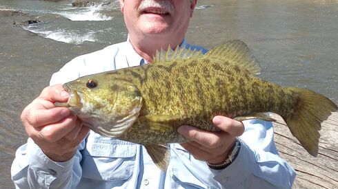Pete Starshak with a good smallmouth bass from the Kankakee River. Provided photo