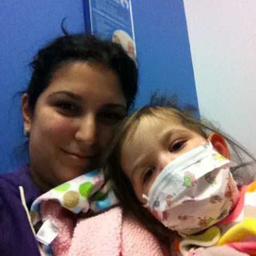 Olivia Donnelly with her mom Lisa Donnelly after the girl’s first heart transplant seven years ago.