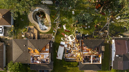 Aerial view of damaged homes in Lansing on Monday, July 27, 2026. Maryann Pozen's home is on the left.