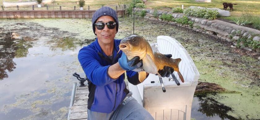Rob Abouchar with a big common carp from Island Lake. Provided photo
