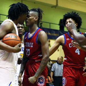 Curie’s Ramean Hinton, right, and Simeon’s Amari Fears go nose-to-nose after a call.