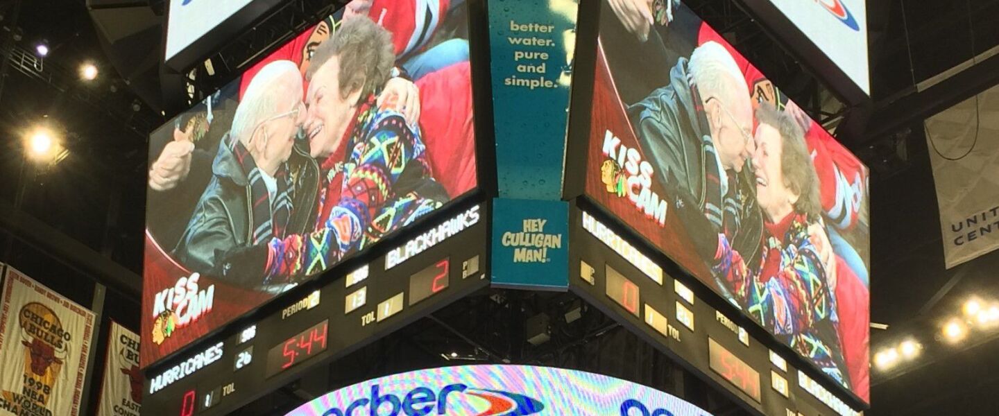Earl and RoseLee Deutsch pucker up for the United Center Kiss Cam.