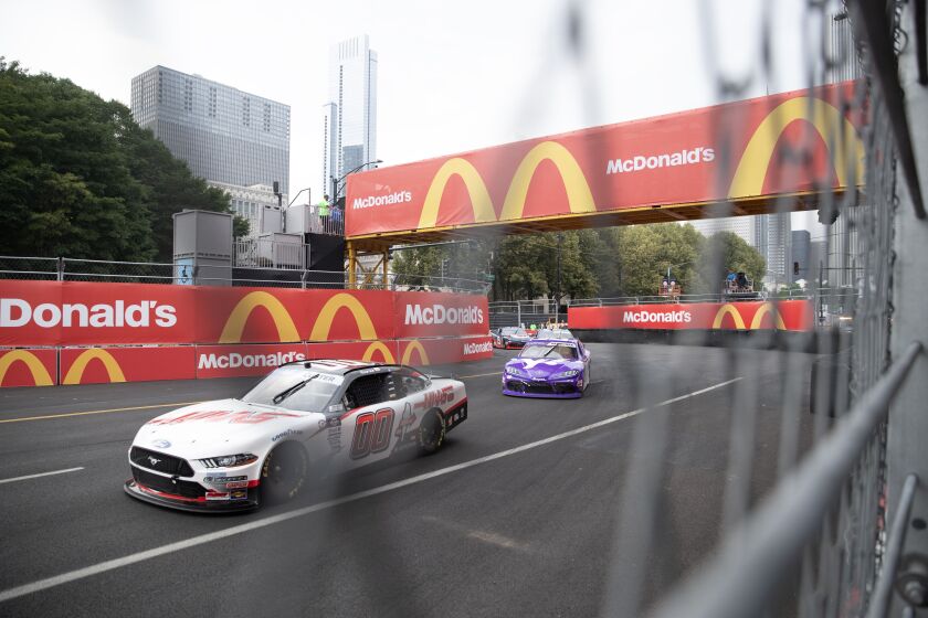 Cole Custer drive south by pit row and the Paddack Club on Columbus Dr. at The Loop 121 NASCAR Chicago Street Race on Saturday, July 1, 2023 in Chicago.