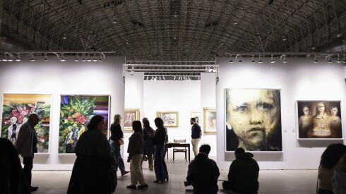 Attendees walk through different galleries at EXPO Chicago at Navy Pier, Friday, April 25, 2025.