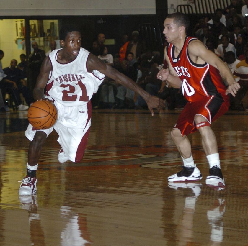Marshall’s Patrick Beverley (21) drives around Bolingbrook’s Will Walker (30) at the M.L.K. National Shootout at Whitney Young