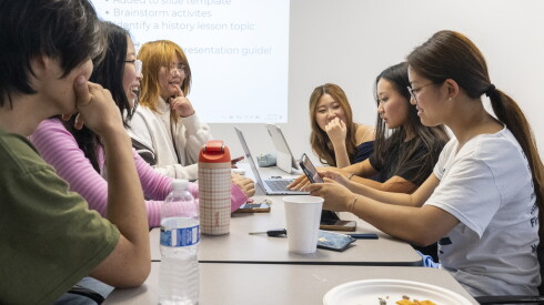 High school students work on a presentation on the Gwangju Uprising and civil rights movements in South Korea during a meeting at the HANA Center – Northwest Center in suburban Prospect Heights, July 30, 2026. | Tyler Pasciak LaRiviere/Sun-Times