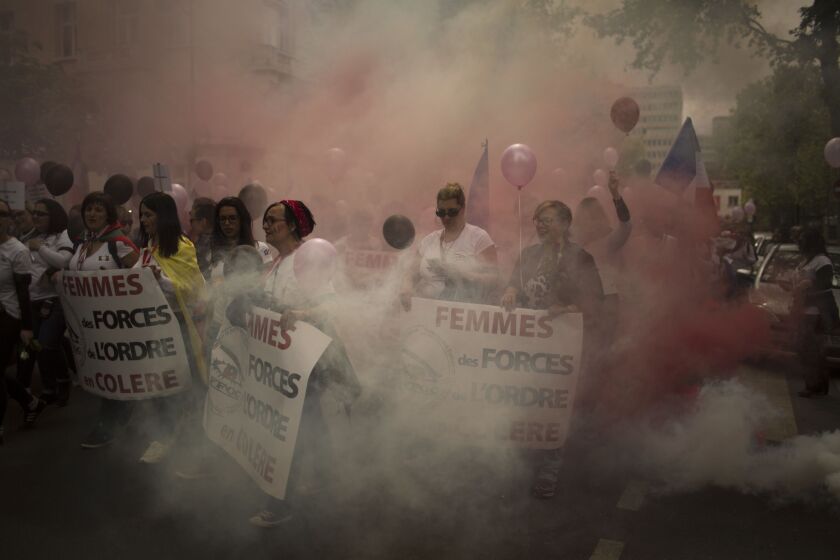 Family members of police officers demonstrate on Saturday in what they described as a march of support for all French security forces. | Emilio Morenatti/Associated Press