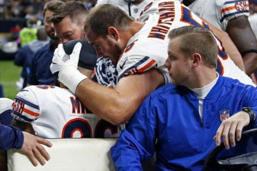 Chicago Bears tight end Zach Miller (86) is is comforted by center Cody Whitehair