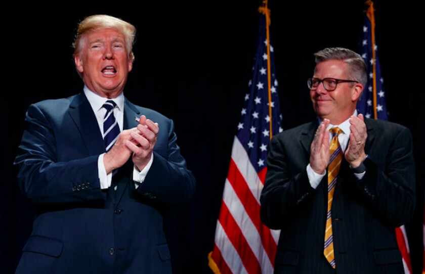 President Donald Trump stands with Rep. Randy Hultgren at the National Prayer Breakfast on Thursday. | AP photo