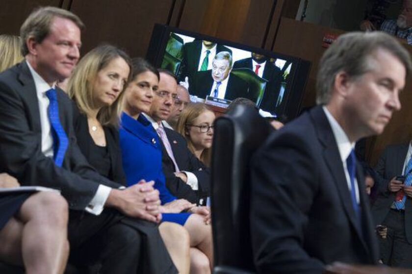 Supreme Court nominee Brett Kavanaugh listens to Sen. Richard Durbin, D-Ill., during Kavanaugh’s Senate Judiciary Committee confirmation hearing in Hart Building on September 4, 2018. White House counsel Don McGahn, left, and Deputy Attorney General Rod R