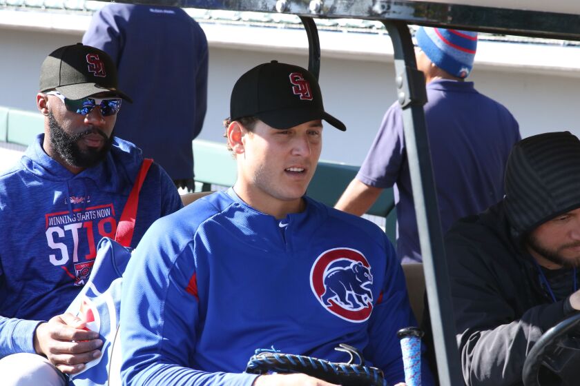 <br>Anthony Rizzo in golf cart after BP wearing Stoneman Douglas High School baseball cap at Sloan Park, Mesa, Arizona. | John Antonoff/For the Sun-Times