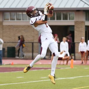 Montini’s Scott West (1) catches a pass. | Allen Cunningham/For the Sun-Times.