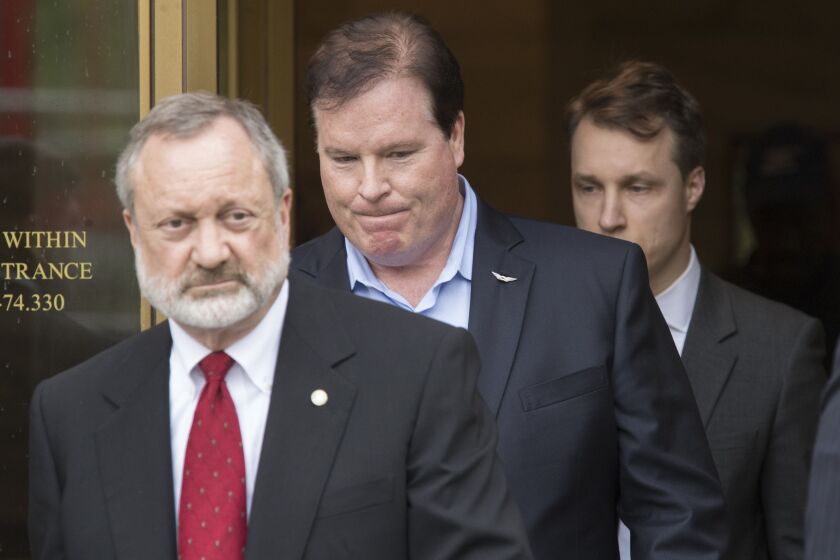 Attorney Jeremy Margolis (left) with client Stephen Calk (center)