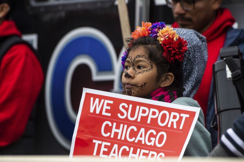 Educators, students, and union laborers rally at Union Park during the Chicago Teachers Union strike Saturday morning.