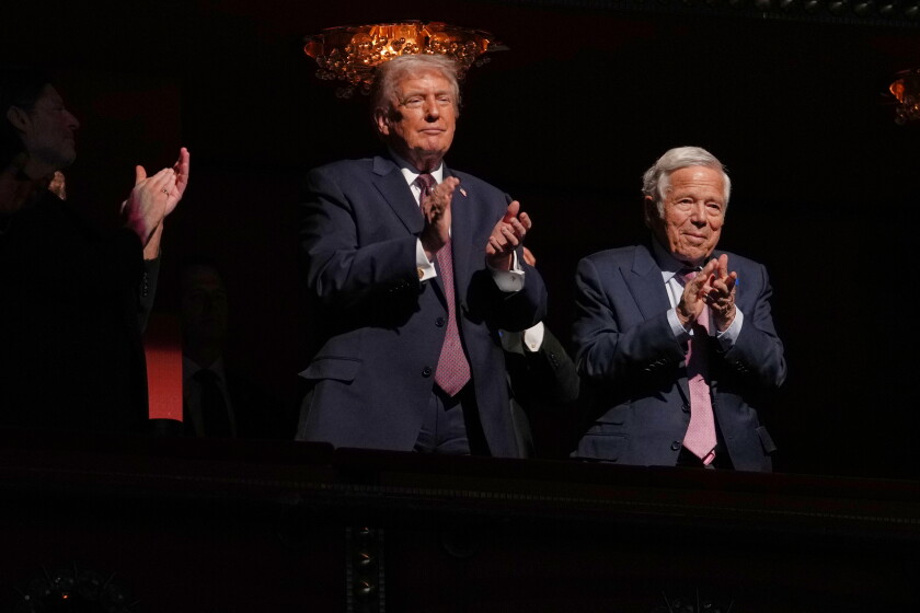President Donald Trump applauds as first lady Melania Trump speaks before the premiere of her movie "Melania" at The John F. Kennedy Memorial Center For The Performing Arts, Thursday, Jan. 29, 2026, in Washington. (AP Photo/Allison Robbert) ORG XMIT: DCJE467