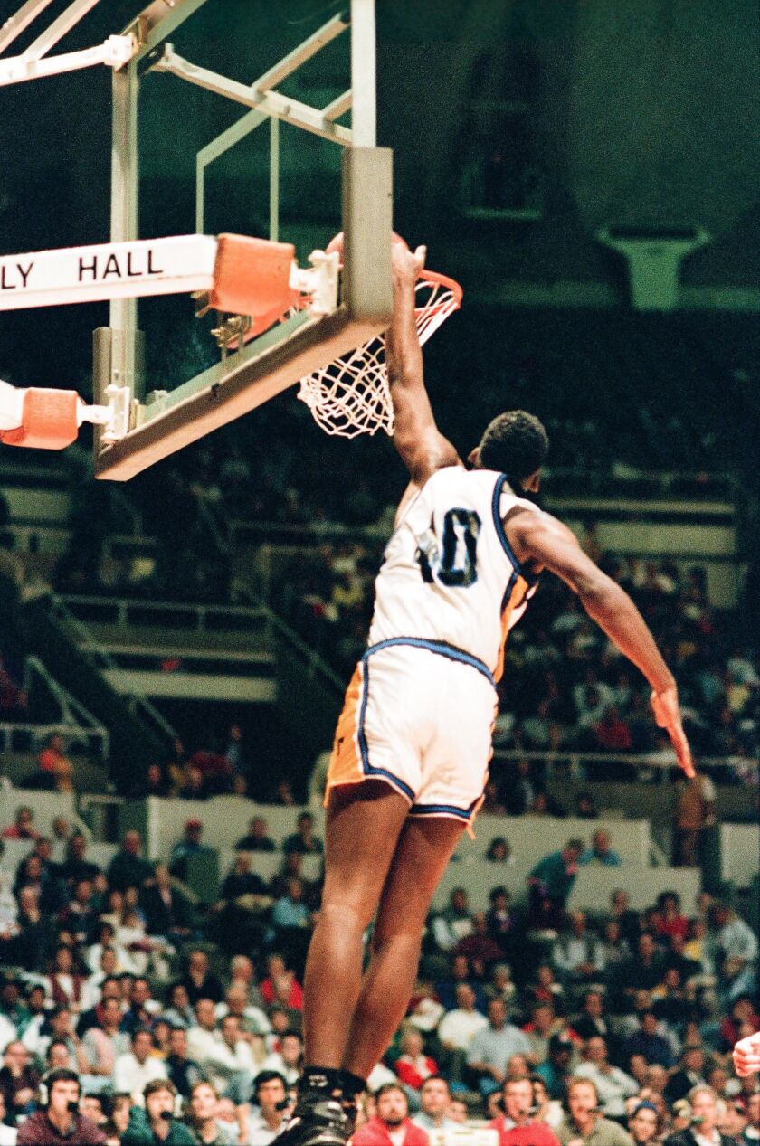 Joliet’s Gary Bell dunks against Carbondale at the state finals in Champaign in 1994.