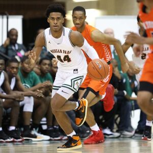 Morgan Park’s Adam Miller (44) brings the ball up court against Young.