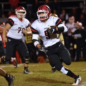 Yorkville’s Cole Ferguson (9) cuts the ball up the middle. Worsom Robinson/For the Sun-Times.
