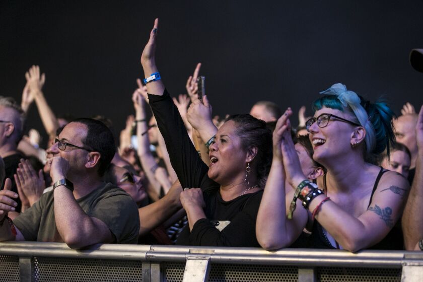 Fans listen to New Order perform on day one of Riot Fest in Douglas Park. | Ashlee Rezin/Sun-Times