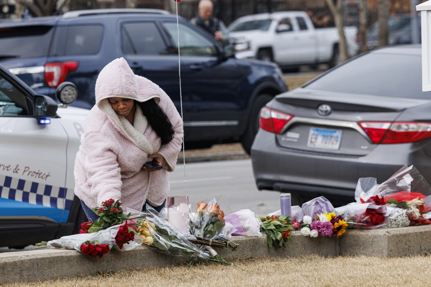 Chicagoans gather to mourn and pay tribute to Rev. Jesse Jackson outside Rainbow PUSH Coalition headquarters following his death in February 2026
