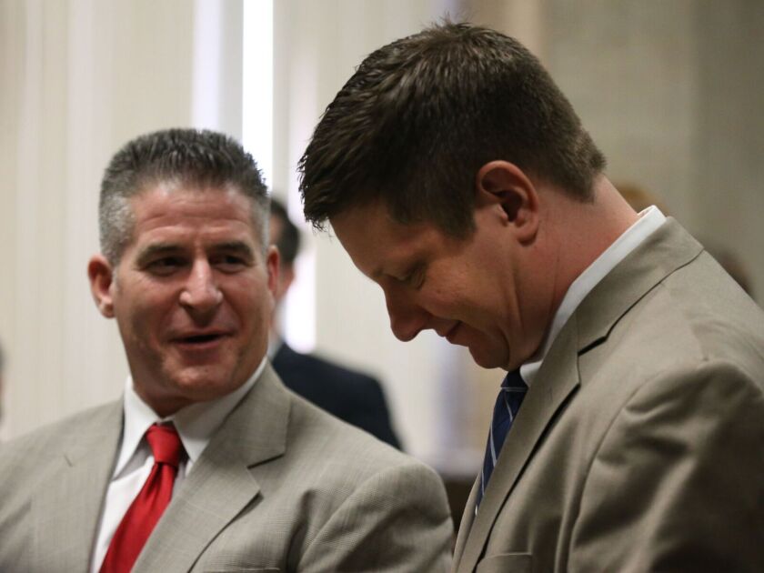 Jason Van Dyke (right) and attorney Daniel Herbert on Nov. 6 at the Leighton Criminal Courts Building. | File photo