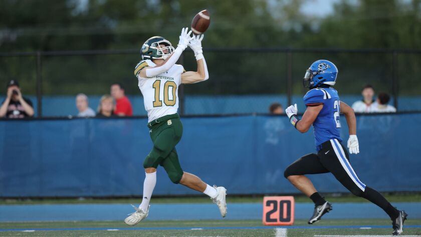 Stevenson’s Ben Snider (10) makes a catch against Lake Zurich.