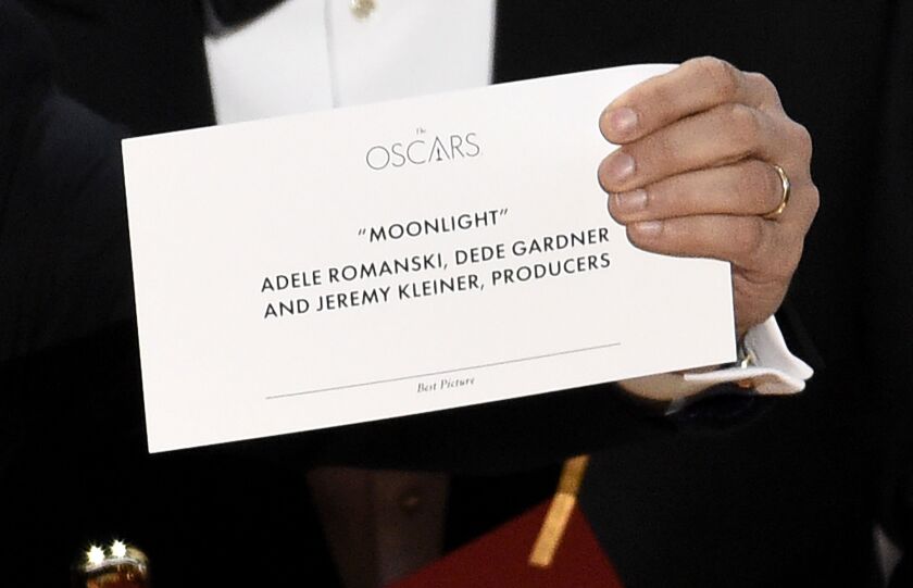 Jordan Horowitz holds up the envelope that reveals “Moonlight” as the winner of the award for best picture at the Oscars on Sunday, Feb. 26, 2017, at the Dolby Theatre in Los Angeles. (Photo by Chris Pizzello/Invision/AP)