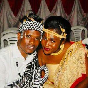 Celestine Mugisha and his wife, Winniefred Akello, pose for a photo in Mbarara, Uganda in November 2018 when Mugisha traveled to Africa to provide Akello’s family with the wedding dowry.