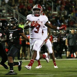 Homewood-Flossmoor’s Leon Tanna (3) scores a touchdown. Homewood-Flossmoor’s Dominick Jones (8) completes a pass. Allen Cunningham/For the Sun-Times.