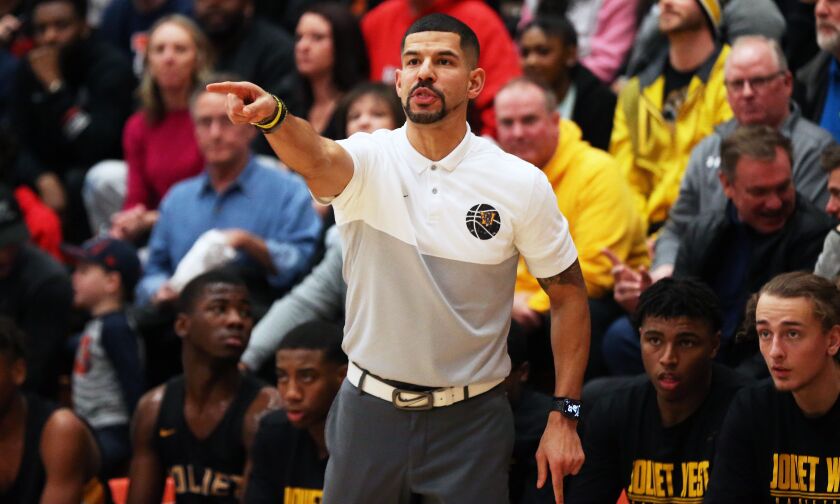 Joliet West coach Jeremy Kreiger directs his players as the Tigers play Simeon.