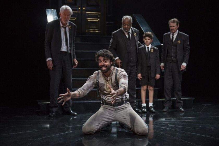 Gary Wingert (standing, from left), Alfred H. Wilson, Michael Ghantous and Thomas Cox, with Gabriel Ruiz (on knees) in the Court Theatre production of “Agamemnon.” (Photo: Michael Brosilow)