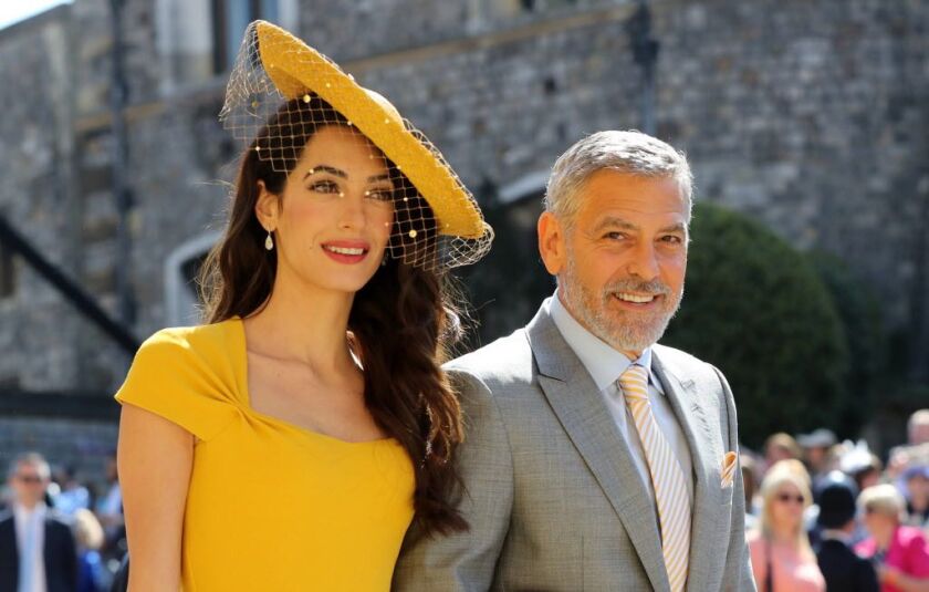Amal Clooney and George Clooney arrive at St George’s Chapel at Windsor Castle before the wedding of Prince Harry to Meghan Markle on May 19, 2018 in Windsor, England. | Gareth Fuller – WPA Pool/Getty Images