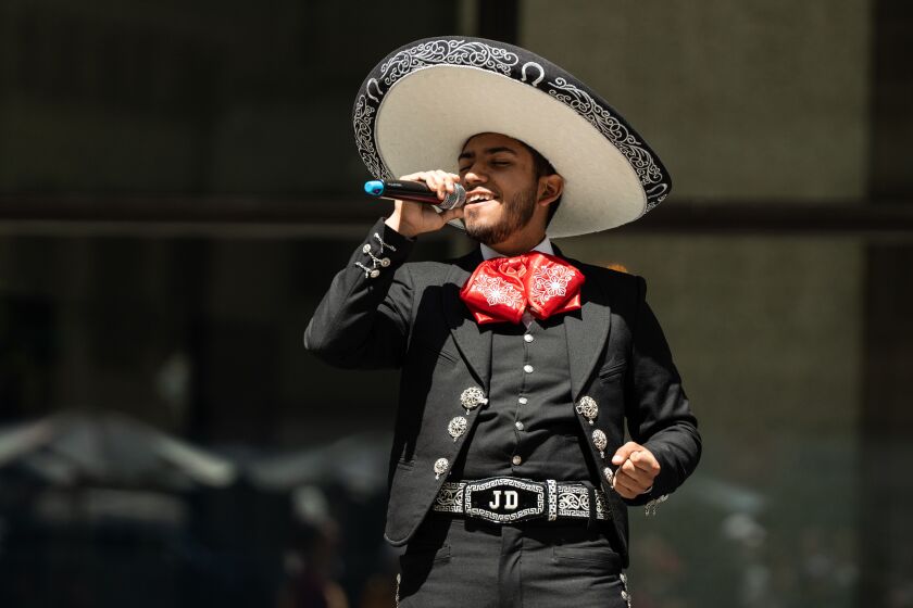 Juan Diego Rojas, 18, sings during a celebration of Mexico Week at Daley Plaza in the Loop, Tuesday, May 9, 2023. | Pat Nabong/Sun-Times