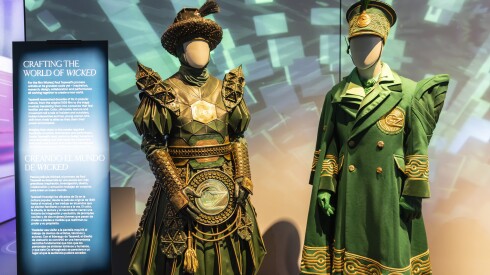 Costumes from the "Wicked" movie are displayed in Paul Tazewell’s new exhibit, "Crafting Character: The Costumes of Paul Tazewell," at the Museum of Science and Industry.