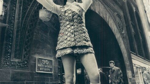 Barbara Blackmon, Miss Chicago Landmark of the Landmarks Preservation Council, hands out buttons outside the old Chicago Stock Exchange Building in 1972.