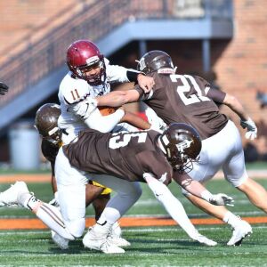 Montini’s Deontay Bell (11) tries to get a first down. Worsom Robinson/For the Sun-Times.