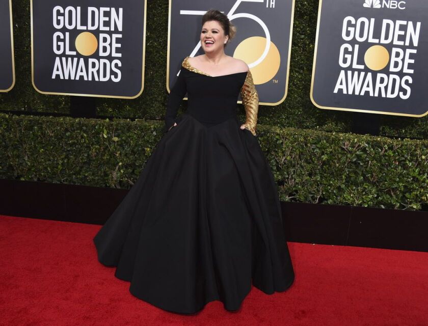 Singer Kelly Clarkson arrives at the 75th annual Golden Globe Awards at the Beverly Hilton Hotel on Sunday, Jan. 7, 2018, in Beverly Hills, Calif. | Jordan Strauss/Invision/AP