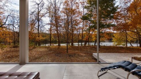 A view of fall foliage and the Fox River from inside the Farnsworth House.