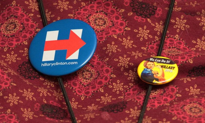 Betty Mocek wears two campaign pins. | Leslie Adkins/For the Sun-Times