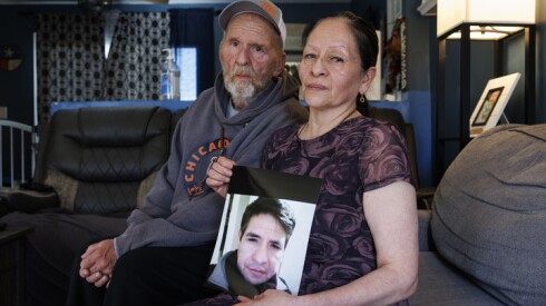 Dora Suane holds a photo of her brother Ricardo Aguayo Rodriguez at her home in Addison. Next to her is her husband Edward Suane.